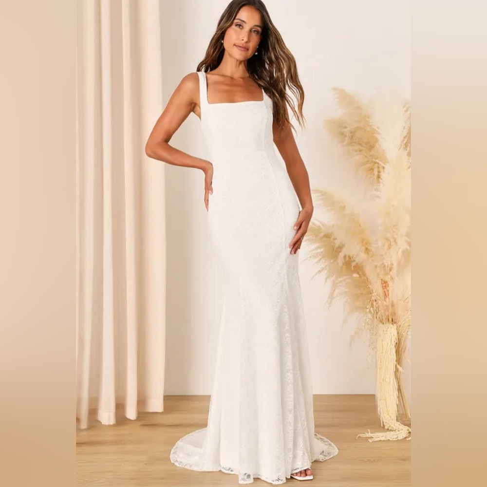 Brand new wedding dress with tags, never worn, mermaid style, beautiful lace